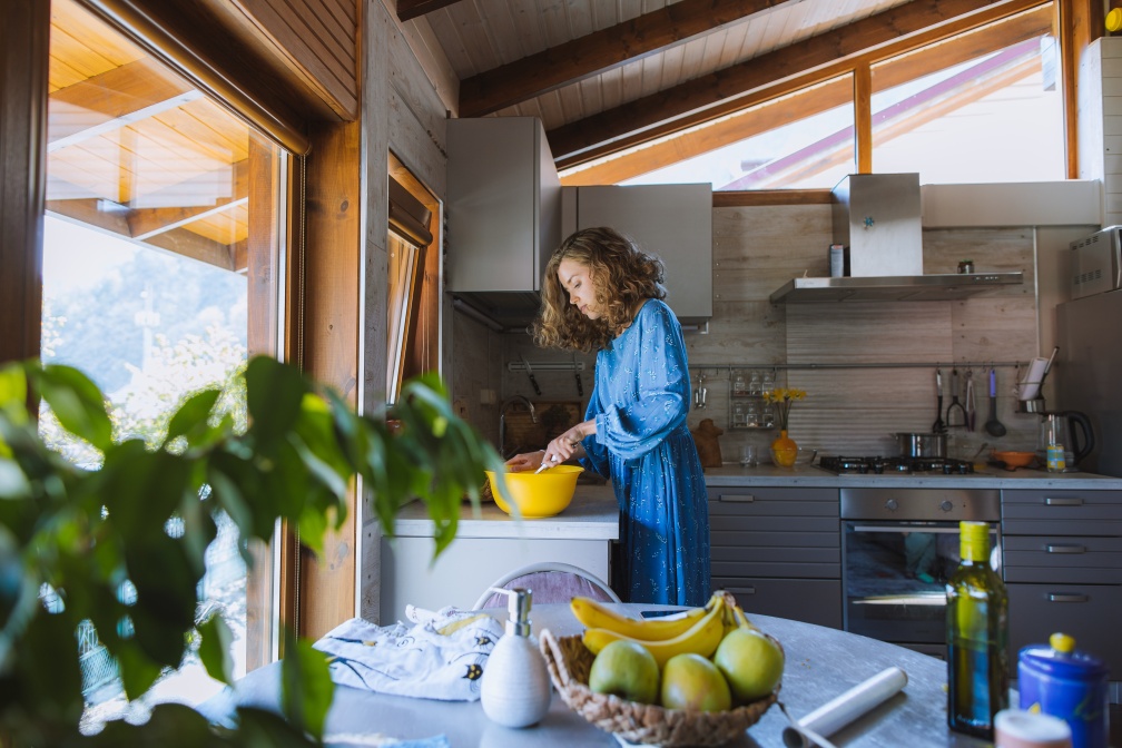 woman cooking a meal in her kitchen