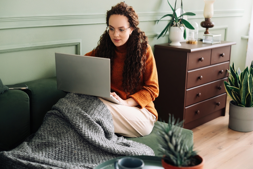 Woman on the couch in an article about online therapy for eating disorder treatment in Manhattan NYC.