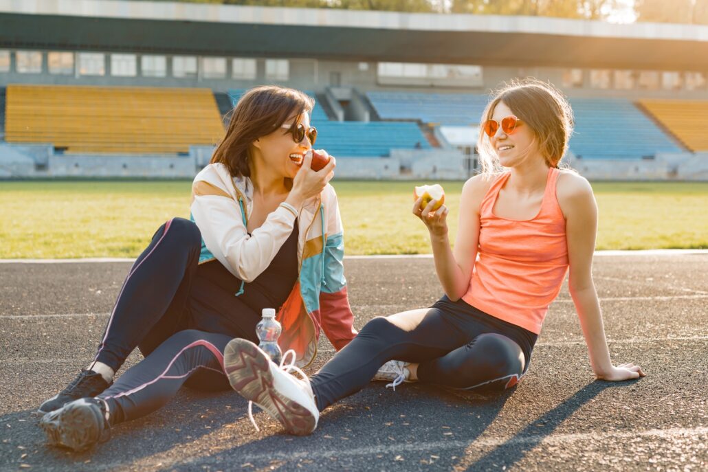 Mother and daughter working out. 